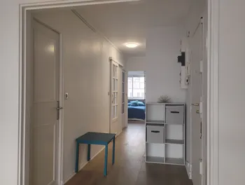 Hallway with storage and blue table