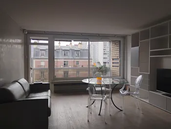 Sofa and glass table with city view