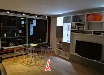 Dining set with city view and bookshelf display